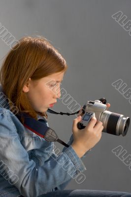 Girl with SLR photo camera