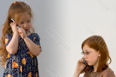 Two girls with cell phones