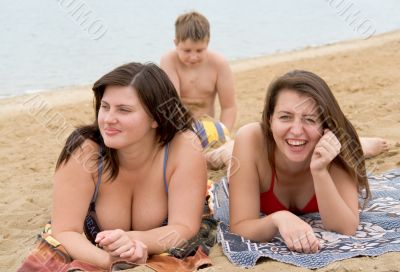women and boy on a beach