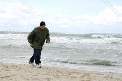 Man is running against the storm