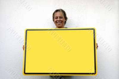 Smiling women with a sign board