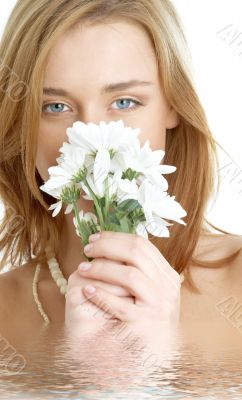 girl with white chrysanthemum in water