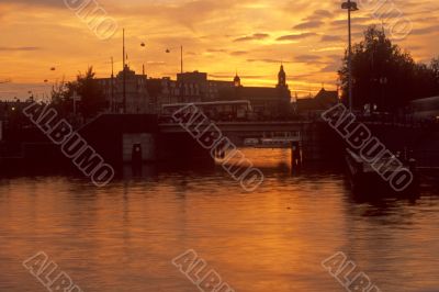 Sunset, bridge and sail boat