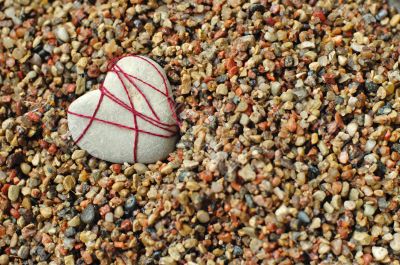 Lonely stone heart at a beach