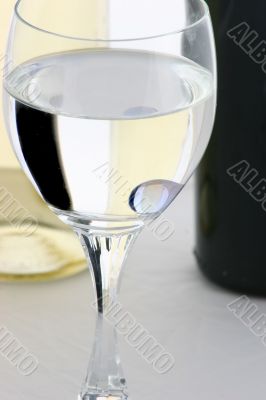 reflection of bottles in  wine glass