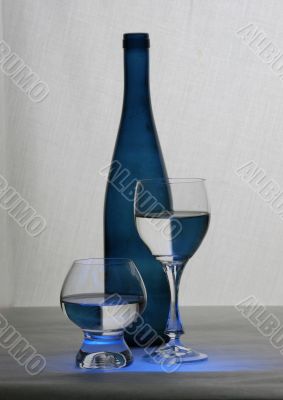 blue bottle and glasses