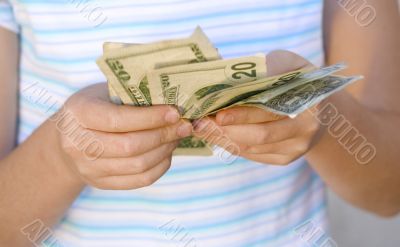 Child counting money (Shallow DOF)