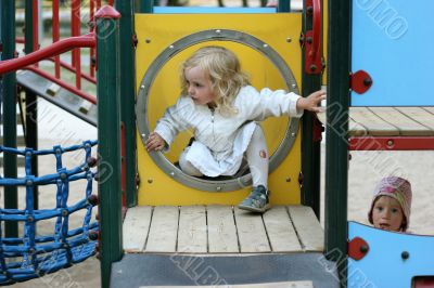 smal girl at the children`s playground