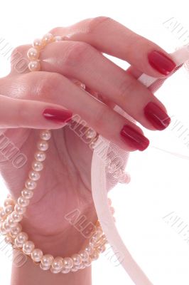 Hand touching a bridal veil