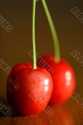 Two red cherries.