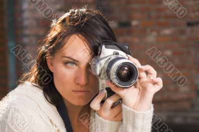 Girl with SLR photo camera
