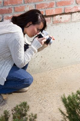 Girl with SLR photo camera