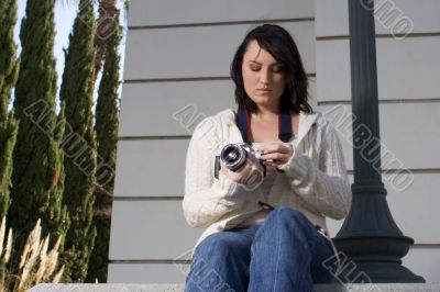 Girl with SLR photo camera