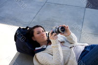 Girl with SLR photo camera