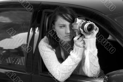 Girl with SLR photo camera