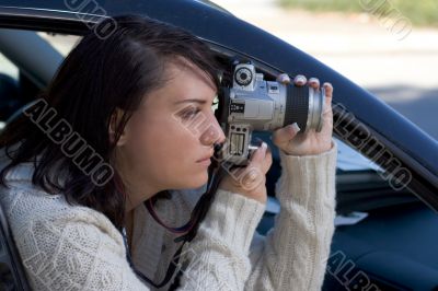 Girl with SLR photo camera