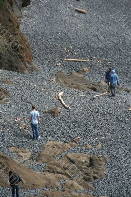 Family exploring rocky beach
