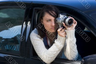 Girl with SLR photo camera