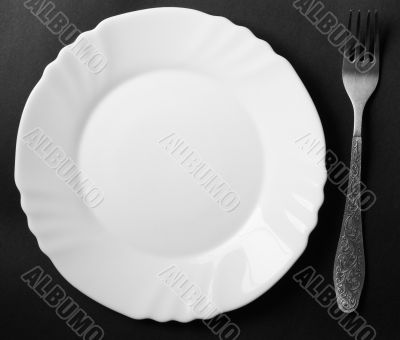 fork and white plate