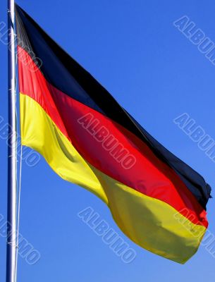 German flag and blue sky