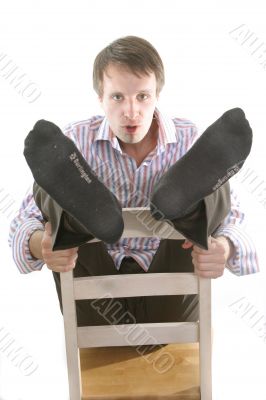 man seating on the chair
