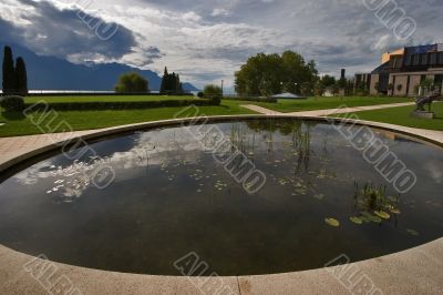 Clouds are reflected in small pool