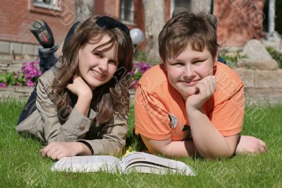 smiling children with a book