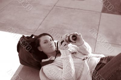 Girl with SLR photo camera