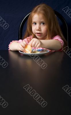 Girl eating orange