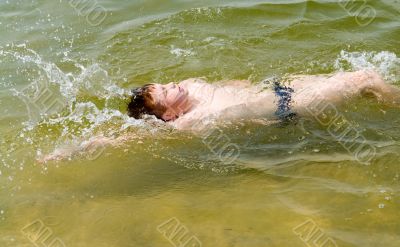 boy swims