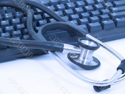 Stethoscope next to computer