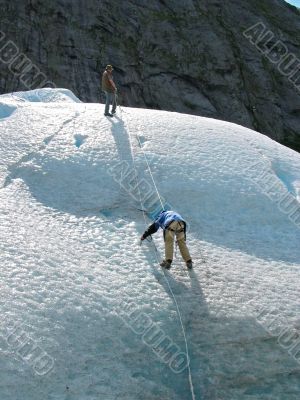 Two ice climbers: teamwork