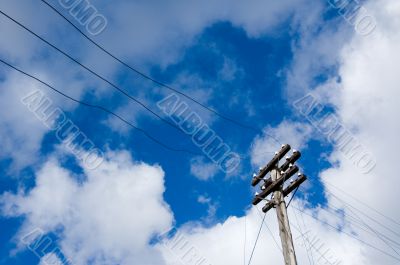telegraph pole over blue sky background