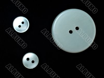 three white buttons