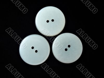 three round white buttons