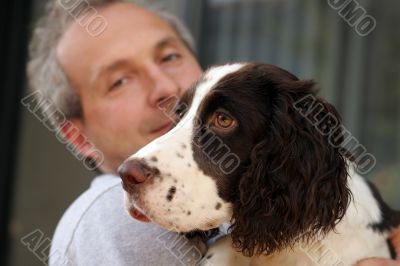 Man Holding His Dog