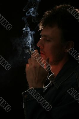 man smoking cigarette