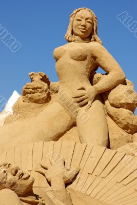 Sculpture  in sand, girl.