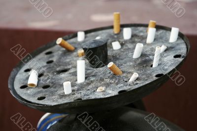 Street ashtray with cigarettes