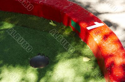 Minigolf grass border and hole