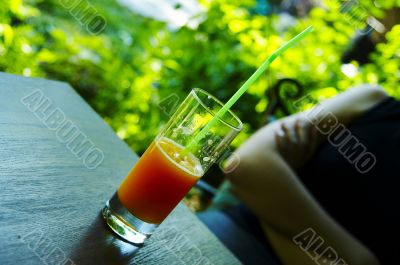 Grapefruit juice in a glass on the table