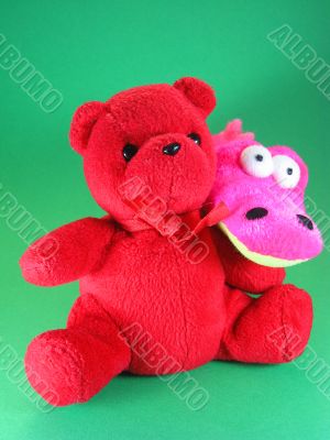 soft toy crocodile and teddy bear