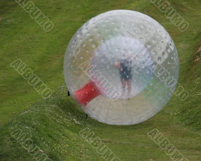 Zorb rolling down a hill