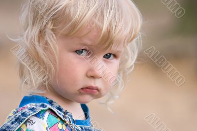 blonde sad little girl