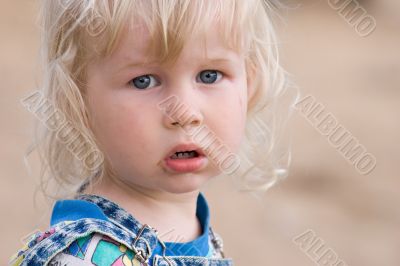 blonde sad little girl
