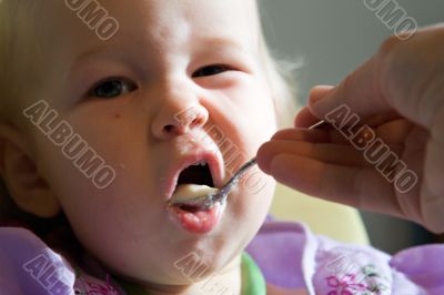 child eating pap