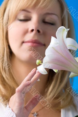 beautiful girl smelling madonna lily