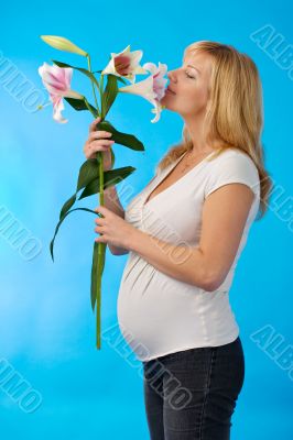 happy pregnant woman with flower