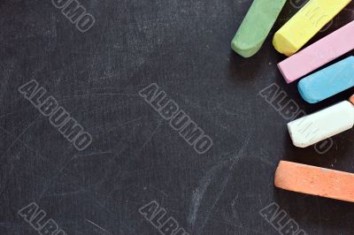 blackboard with coloured crayons
