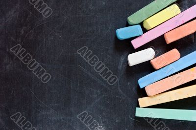 blackboard with coloured crayons